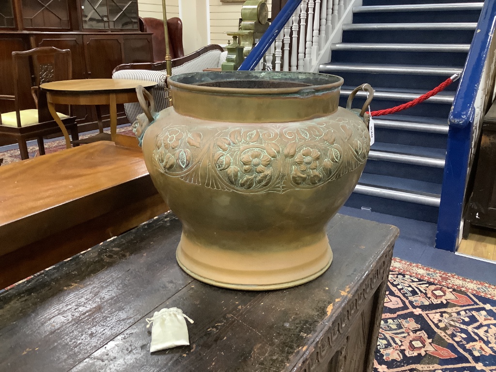 A late 19th century embossed brass jardiniere, height 36cm